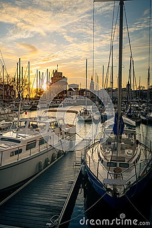 Colorful sailboats at sunset in the old harbor of La Rochelle France Stock Photo