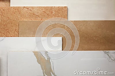 Colorful samples of marble and ceramic tiles displayed in shop close up Stock Photo