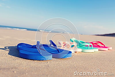 Colorful sandals at the beach Stock Photo