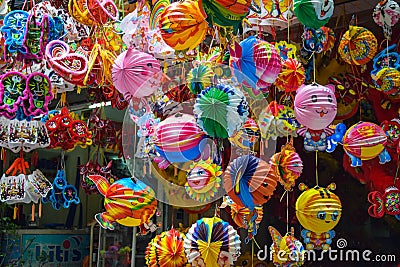 Colorful scene, friendly vendor on Hang Ma lantern street, lantern at open air market, traditional culture on mid autumn Stock Photo