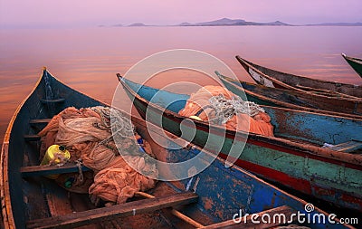 Colorful scenic sunset with fishing boats on Mfangano Island, Lake Victoria, Kenya Stock Photo