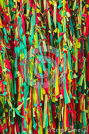 Colorful scrappy fabric. Colorful peaces of clothes be bind together on tree by people who believed this will exorcise their fate. Stock Photo