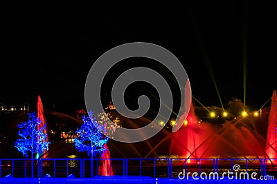 Colorful season trees and jets of dancing waters at Seaworlds Christmas Celebration. Editorial Stock Photo