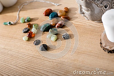 Colorful semiprecious stones on brown wooden surface Stock Photo