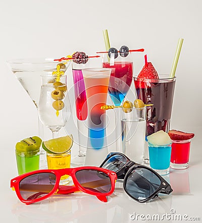 Colorful set of drinks, color drink decorated with fruit, sunglasses, drink straw, color shots Stock Photo