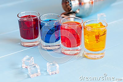 Colorful shot cocktails close up with ice cubes on Stock Photo