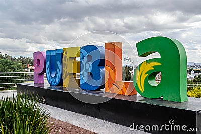 Colorful Sign for Puebla overlooking the city from Los Fuertes Editorial Stock Photo