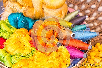 Colorful silk thread and silkworm cocoons Stock Photo