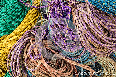 Colorful sink, hydropro and float ropes used for lobster traps piled up Stock Photo