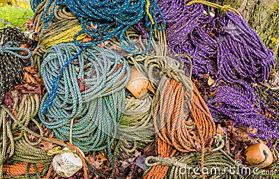 Colorful sink, hydropro and float ropes used for lobster traps sit in a big pile Stock Photo