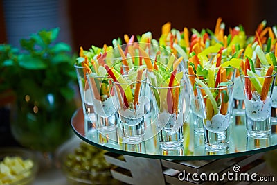 Colorful slices of raw vegetables in glasses Stock Photo