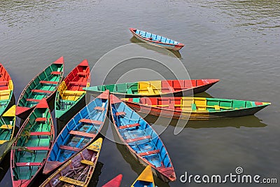 Colorful small boats on Phewa Lake in Pokhara, Nepal Stock Photo