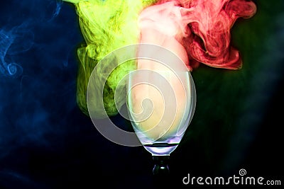 Colorful smoke in the cocktail glass Stock Photo