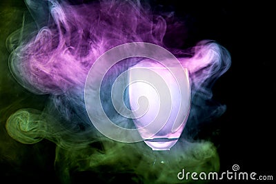 Colorful smoke in the cocktail glass Stock Photo