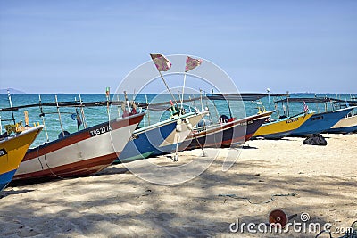 South-East Asian fishing boats resting at the beach in Kuala Terengganu, Malaysia Editorial Stock Photo