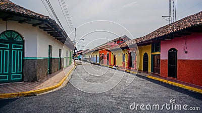Colorful Spanish colonial street in Granada Stock Photo