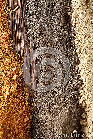 Colorful spice background with different color spices, macro, selective focus, vertical, selective focus. Stock Photo