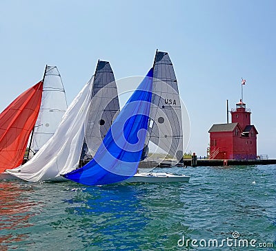 Colorful spinnakers on sailboats in harbor Stock Photo