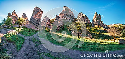 Colorful spring panorama of Cappadocia. Early morning scene of Uchisar Castle. Sunrise in famous Uchisar village, district of Stock Photo