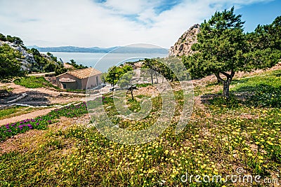 Colorful spring view of Agios Ioannis Church. Splendid morning scene of West Court of Heraion of Perachora, Limni Vouliagmenis Stock Photo