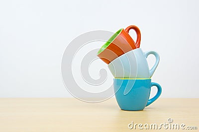 Colorful stack coffee cups on wood board Stock Photo