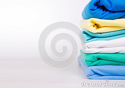 Colorful stack of cotton clothes whith empty copy space background Stock Photo