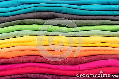 Colorful stack of t-shirts clothes texture background Stock Photo