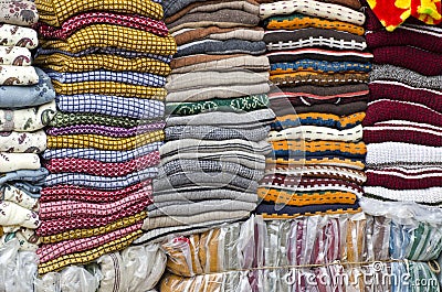 Colorful stacked fabric in big market , India Stock Photo