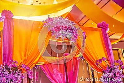 Colorful stage decoration for bride and groom in sangeet night of indian wedding Stock Photo