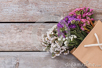 Colorful statice limonium flowers in paper bag. Stock Photo