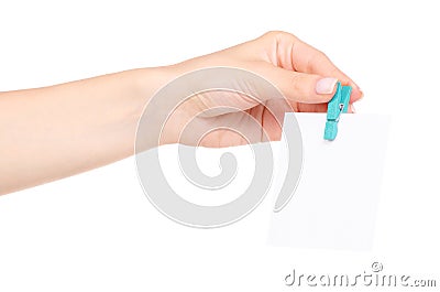 The colorful stationery clothespins with paper for notes in hand Stock Photo