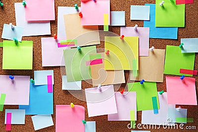 Colorful sticky notes on cork bulletin board Stock Photo