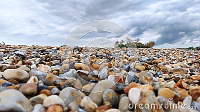 Colorful stone beach in Newhaven, clean blue water, England just beautiful! Stock Photo