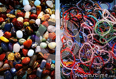 Colorful stones rolled uniquely and bracelets Stock Photo