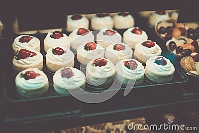 Colorful strawberry cakes selling in shop at Granville island public market Stock Photo