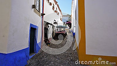 A colorful Street in the medieval town of Obidos, Portugal. Stock Photo