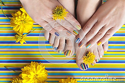 Colorful striped fashion summer pedicures and manicures Stock Photo