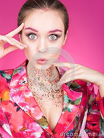 Colorful Studio portrait of a beautiful young woman with eyes wide open Stock Photo