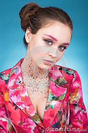 Colorful Studio portrait of a beautiful young woman on light blue background Stock Photo