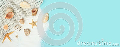 Colorful summer banner with mesh, seashells and starfish with sand on a blue background Stock Photo