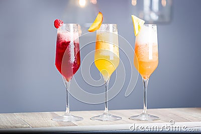 Colorful Summer Cocktails with Prosecco, Three Kind of Fruit Cocktails - Raspberry, Peach and Pineapple, Horizontal Wallpaper Stock Photo