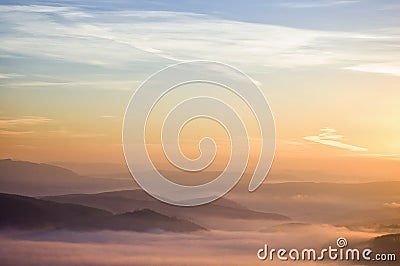Colorful summer morning with golden light and fog Stock Photo