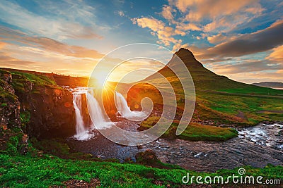 Colorful sunrise on Kirkjufellsfoss waterfall Stock Photo