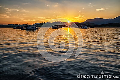 Colorful sunset on lake Liptovska Mara, Slovakia. Houseboats on water Stock Photo