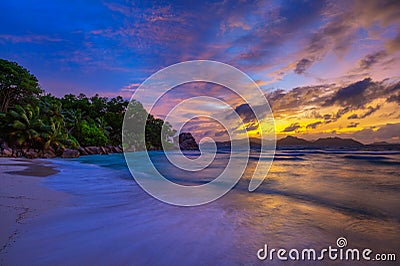 Colorful sunset over Anse Severe Beach at the La Digue Island, Seychelles Stock Photo