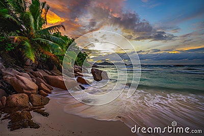 Colorful sunset over Anse Severe Beach at the La Digue Island, Seychelles Stock Photo