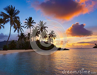 Colorful sunset over tranquil tropical island with silhouetted palm trees Stock Photo