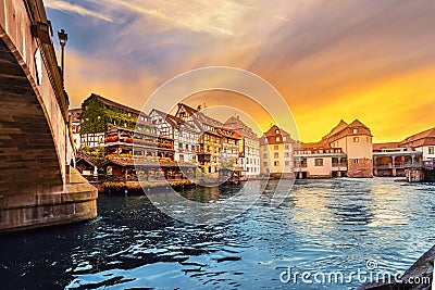 sunset in the region of Little France in the city of Strasbourg. Famous half-timbered houses, the river Ill and the Stock Photo