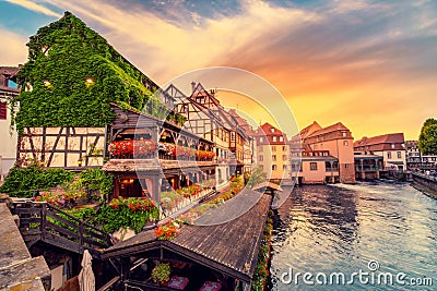 sunset in the region of Little France in the city of Strasbourg. Famous half-timbered houses, the river Ill and the Stock Photo