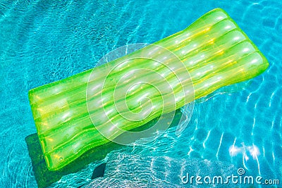 Colorful swim ring or rubber float around swimming pool water Stock Photo